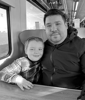 Philip Austin with his son